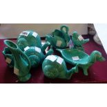 Six Anglia Pottery green glazed animal figurines and two vases