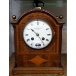 An Edwardian inlaid mahogany cased bracket style mantel clock with S. Marti, gold medal, eight day
