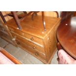 A 3' 4 1/2" 19th Century pitch pine chest of three long graduated drawers, set on bracket feet