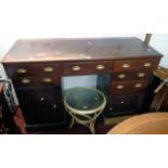 A 5' 5" Victorian mahogany clerk's desk with sloping top, three frieze drawers, the twin pedestals