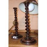 A pair of turned oak barley twist candlesticks