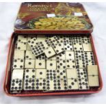 A part set of bone and ebony nine spot dominoes - four short