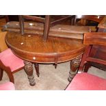 A 3' 6" diameter late Victorian stained oak extending dining table with two leaves and winder, set