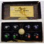 A boxed set of vintage Banda carpet bowls