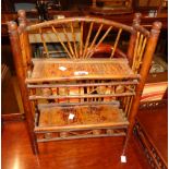 A 14" late 19th Century freestanding bamboo and cane two shelf unit with slatted surfaces