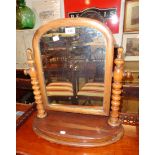 A Victorian mahogany framed platform dressing table mirror with arched plate, flanking bobbin turned