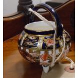 A Royal Crown Derby miniature cauldron - one leg restored