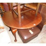 A late Victorian mahogany extending dining table with single leaf, set on heavy cabriole legs with