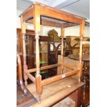 A 23" early 20th Century stained oak occasional table, set on slender turned supports