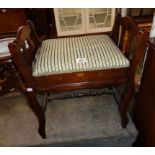 An Edwardian stained walnut locker piano stool with transfer decoration and upholstered seat, set on