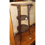 An early 20th Century stained oak three tier occasional table with bracketed top