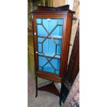 A 22" Edwardian mahogany and strung corner cabinet with later material lined interior enclosed by an