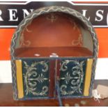 A 15 3/4" vintage wall mounted decorative dome-top cabinet with shelf and pair of doors under