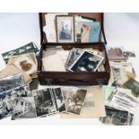 An old vintage suitcase containing a collection of early to mid 20th Century photographic ephemera