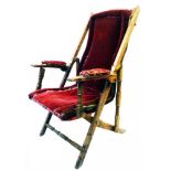 A Victorian stained hardwood and brass mounted campaign style folding armchair with remain of