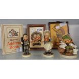 Three Hummel figures, associated pottery wall plaque, wooden wall plaque, and a Hummel address book