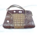 A vintage crocodile skin handbag