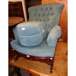 An Edwardian stained walnut framed rocking armchair with later button back frosted blue velour