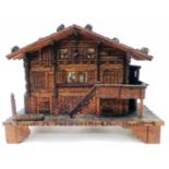 A Swiss carved wood musical jewellery box in the form of a chalet by Chevob & Co., late Baker-