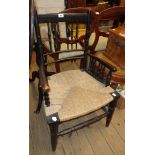 A late Victorian simulated bamboo ebonised framed elbow chair, with woven seagrass seat panel