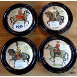 Four framed military china plaques