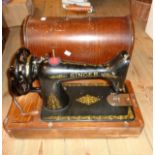 A vintage cased Singer sewing machine