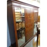 A 6' 11" Victorian quarter veneered and strung walnut triple compactum wardrobe with moulded
