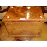 A 15 1/4" polished Eastern hardwood lift-top box with internal candle box and flanking brass drop