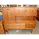 A 5' retro G-Plan teak veneered wall unit with double cupboard and fall-front compartment to top