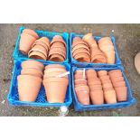 Four crates containing vintage terracotta garden pots - various sizes