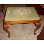 An early 20th Century stained walnut framed dressing stool with original floral tapestry to drop-