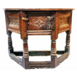 A 3' 2" late 17th Century oak credence table with flanking carved panels to canted sides and central