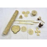 A small collection of antique carved ivory items including Napoleon's Tomb souvenir, needle case,