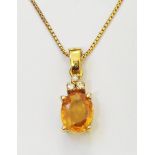 A high carat yellow metal pendant, set with oval yellow sapphire and tiny diamonds, on marked 999