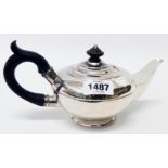 A silver teapot of squat bulbous design with wooden knop and handle, the base with presentation text
