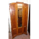 A 35" 1930`s polished oak and mixed wood wardrobe with hanging space enclosed by a mirror panel door