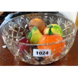 A cut glass bowl containing assorted glass fruit