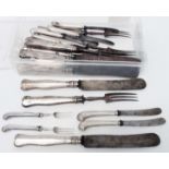 A collection of antique English and French silver handled knives and forks - various styles