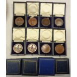 Eighteen cased bronze medallions for Cooperative Wholesale Society Baking Exhibition
