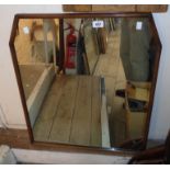 An oak framed wall mirror with canted top