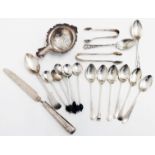 A collection of small silver spoons, silver tea strainer, etc. - various condition