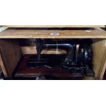 A late Victorian W. Sellers & Sons Stitchwell sewing machine in pine box