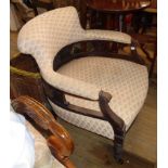 An Edwardian stained walnut framed tub elbow chair with acanthus scroll arm rest terminals and