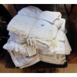 Two bundles of table linen including embroidered tablecloth