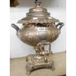 A Victorian silver plated copper ornate pedestal tea urn with push-fit lid, acanthus handles and