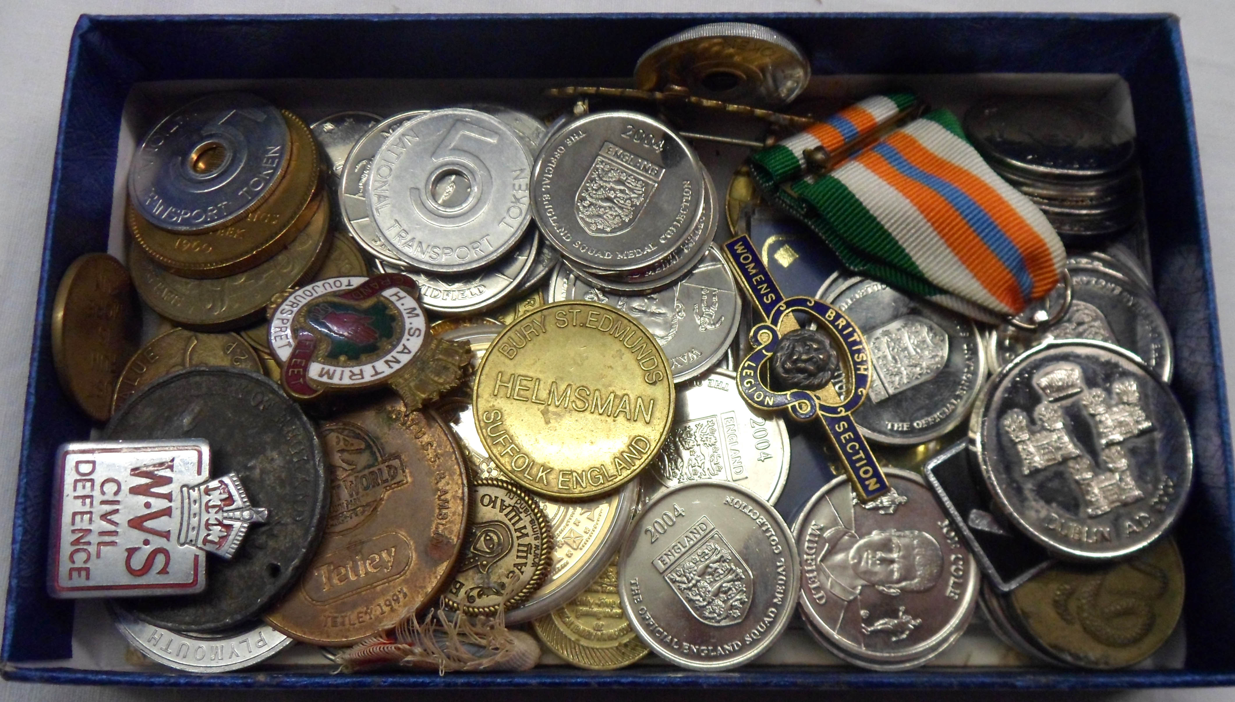 A box containing various collectables including HMS Antrim, WVS, and British Legion Women's Section,