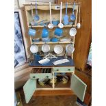 A vintage scratch built wooden child's kitchen dresser with plate rack over two drawers and cupboard