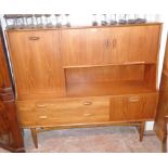 A 5' retro G-Plan teak veneered wall unit with double cupboard and fall-front compartment to top