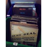 Two boxes containing a quantity of records including Small Faces, Elton John, Simon & Garfunkel