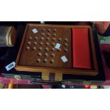 A wooden solitaire game and cased backgammon set